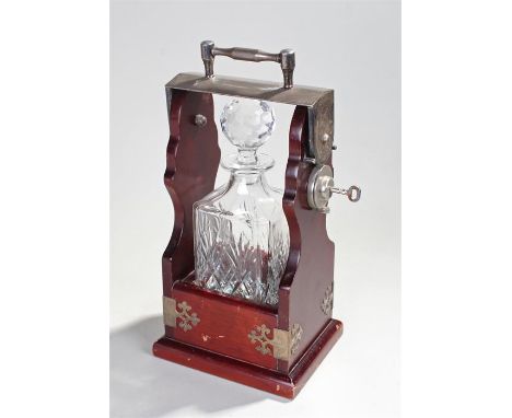 20th century mahogany Tantalus containing one decanter with silver plate handle and scroll fittings 18cm wide  35cm high 14cm