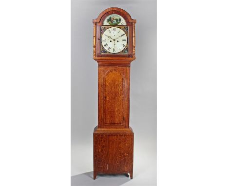 19th Century oak longcase clock, the arched top above a glazed hood and turned columns, arched trunk door with panel base, th