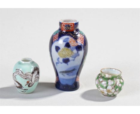 Japanese miniature Fukagawa porcelain miniature vases, to include a green ground and flower design vase, a pastel green stork