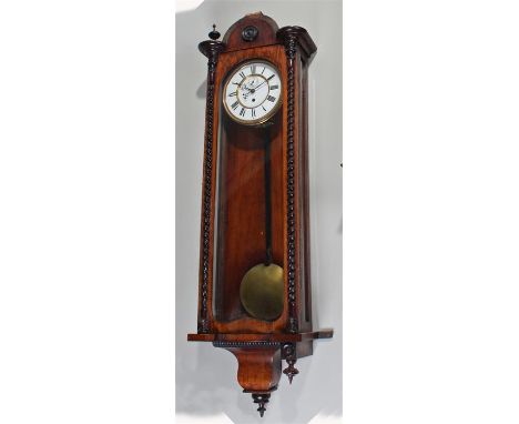 Late 19th Century rosewood Vienna wall clock, the case surmounted by a finial flanked arch above barley twist half columns to