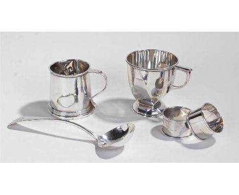 Silver objects, various dates and makers, to include two mugs, a ladle and two napkin rings, total weight 9.8oz
