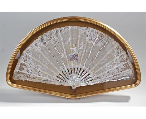 Early 19th Century silk and mother of pearl fan, the silk fan painted with a lady playing the harp and cherubs to the leaf de