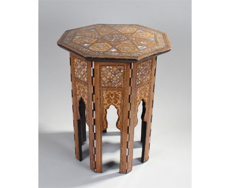 Middle Eastern mother of pearl inlaid occasional table, the polygon top with geometric inlaid design above arched supports, 4