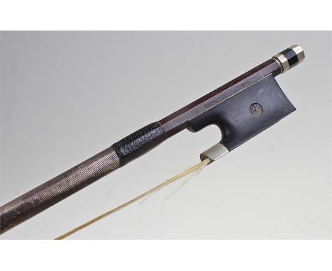 Fetiqura of Paris violin bow, the ebonised and mother of pearl inset frog, signed stick, 74.5cm long