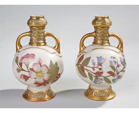 Pair Royal Worcester blush ivory porcelain vases, of circular baluster form with twin handles and moulded Middle Eastern styl