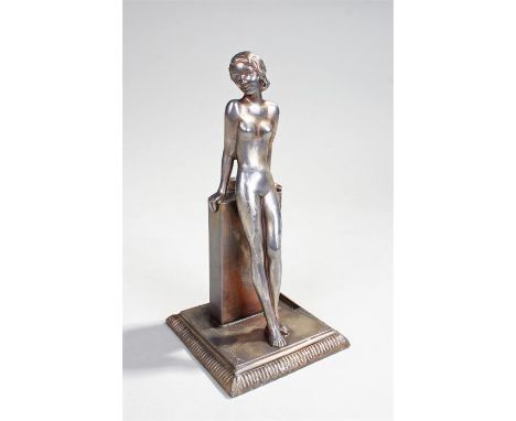 Josef Lorenzl (circa 1930)  a silvered table lighter in the form of a standing nude, with the original striker and standing o