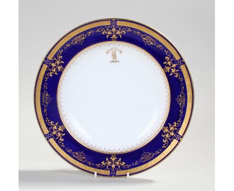 Coalport porcelain bowl, with an heraldic crest D'ACCCOMPLIR AGINCOURT, with a blue and gilt swag surround, 26cm diameter 