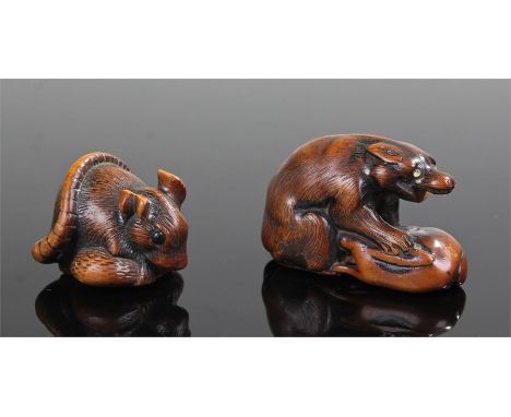 Two 19th Century Japanese carved wood netsuke, the first as a rat clutching a seed, 3.7cm long, the second carved as a beast 
