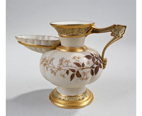 Royal Worcester jug in the form of an antique oil lamp; the cream coloured jug with gilt ivy leaf decoration, the base with g