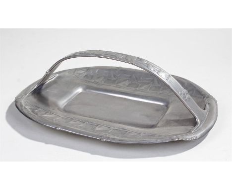 Archibald Knox Tudric pewter for Liberty's pewter basket, the arched handle above an overlay leaf pattern to the surround of 