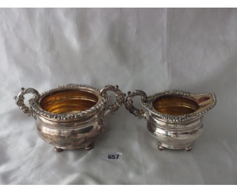 Old Sheffield plated cream jug and matching sugar  basin, heavy gadrooned foliate rims, 7.5" over handle  