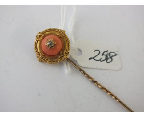 Gold mounted coral stick pin      