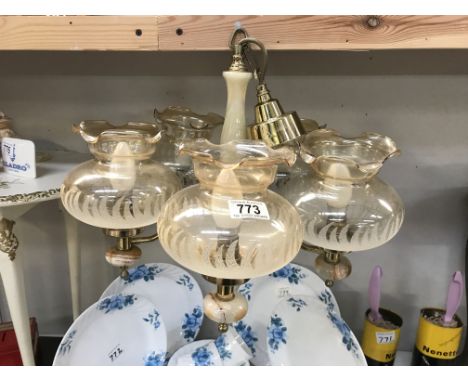 An onyx &amp; brass 5 arm chandelier ceiling light