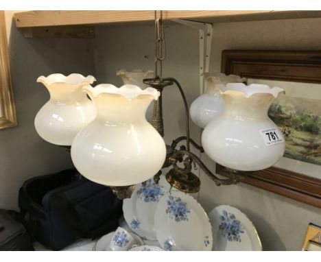 A brass 5 arm chandelier ceiling light