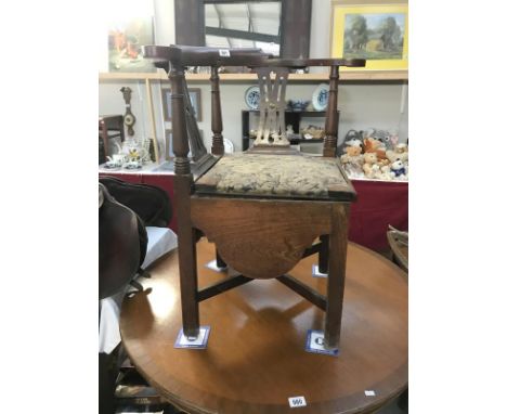 An unusual Victorian oak corner chair commode