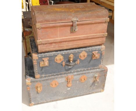 Two travelling trunks and a tin trunk 