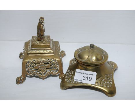 Art Nouveau brass inkwell and brass inkwell with Oriental finial and pierced decoration on claw feet