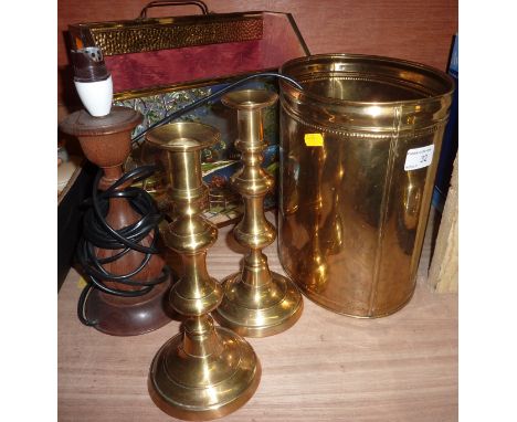 Brass coal bucket, pair of brass candlesticks, brass covered magazine rack with foil decoration and a wooded table lamp  