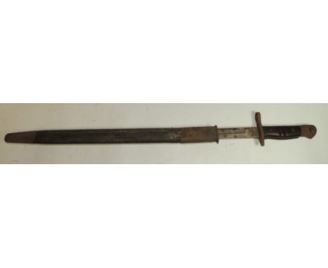 A US Remington bayonet with wood grip and in original leather scabbard ++blade very rusted, removes from scabbard with diffic