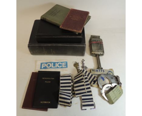 Police related items - an early hand held candle lamp; two blue/white striped arm bands; boxed pair Hoatts handcuffs; Police 