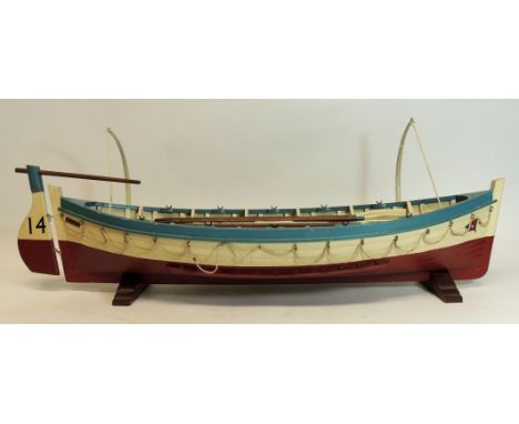 A well constructed painted wood model of SS Titanic lifeboat no.14, complete with 10 oars, mast with furled sail, first aid a