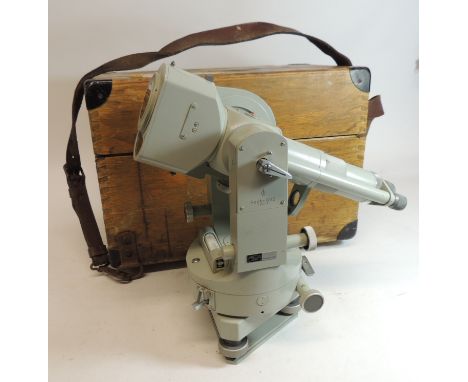 A Carl Zeiss theodolite, grey painted, with lighting facility and in fitted oak box