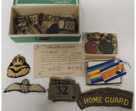 One large brass RFC button and 5 smaller; some WWII dog tags ; medal box with ribbons but no medals;  Home Guard cloth should