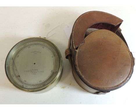 A military barometer by J Hicks, London, in circular brass case with silvered metal dial, makers name engraved to the dial an