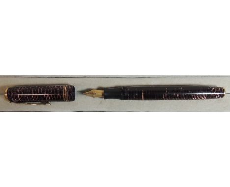 A Canadian Parker Vacumatic fountain pen in burgundy/jet striped case, with original Parker "arrow" nib, c.1933 ++good condit