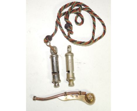 A brass and copper Bosuns whistle; a WWI period Hudson whistle dated 1916 and a later Hudson whistle with arrow mark and on c