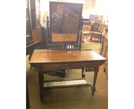 A late Victorian Edwards & Roberts solid walnut dressing table, adjustable mirror above two frieze drawers, spindle detail, u