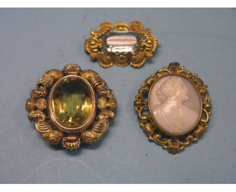 Three Victorian yellow-coloured metal brooches, large citrine, aquamarine and a cameo female portrait 