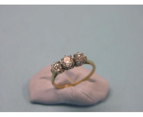 A yellow metal and diamond half-hoop ring, three claw-set stones, each approx. 0.35ct., size M