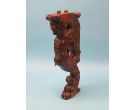An 18th century Italian carved walnut caryatid, 26in., a Venetian bevelled mirror, within mirrored borders, 18in. high and tw