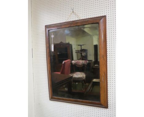 A Queen Anne-period walnut mirror, rectangular-shape with cushion frame, original bevelled plate, circa 1710, 2ft. 9in. x 2ft