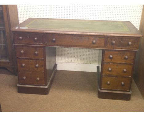 A Victorian walnut pedestal desk, with inset gilt-tooled leather top, kneehole arrangement of nine drawers, turned wood knob 