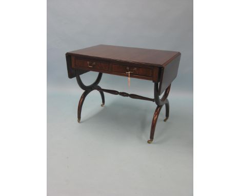 A reproduction inlaid mahogany sofa table, with two frieze drawers, on X-form end supports with brass cup casters, 3ft. 2in. 