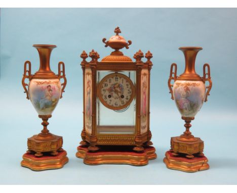A 19th century French clock garniture, eight-day Mougin movement striking on a gong, ceramic dial painted and gilded, hexagon