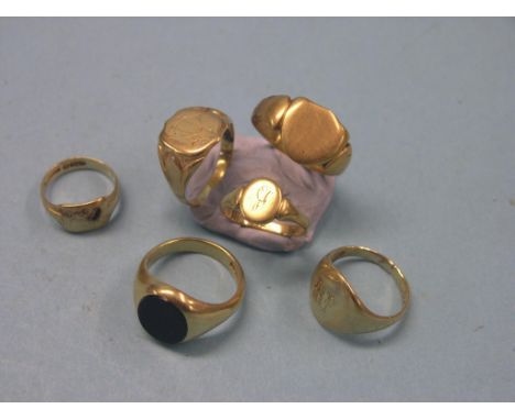 Four various 18ct. gold signet rings, 18 grams total, another with inset stone, 10.2 grams gross and a yellow metal signet ri