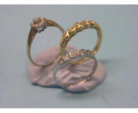 An 18ct. gold ring, set five small diamonds, a 9ct. white gold and diamond ring and a gold and diamond cluster ring 