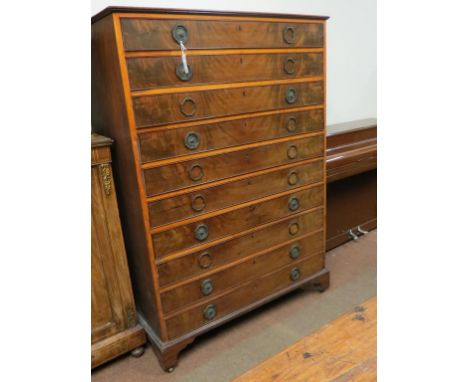 An unusual early 19th century mahogany tallboy, ten flame-veneered drawers, original octagonal embossed brass handles, on bra