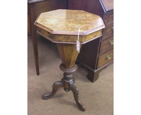 A Victorian burr walnut work table, octagonal top on carved tripod base, interior as viewed