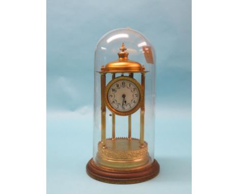 A bandstand 400-day clock, enamelled dial and timepiece movement, columnar brass case under glass dome, with pendulum