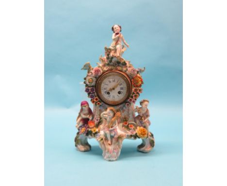 A 19th century Sitzendorf-type porcelain mantel clock, mounted with four youths emblematic of The Seasons, floral encrusted t