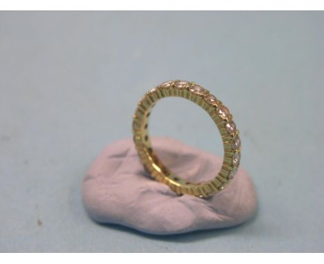 A yellow metal and diamond full eternity ring, numerous diamonds, size P