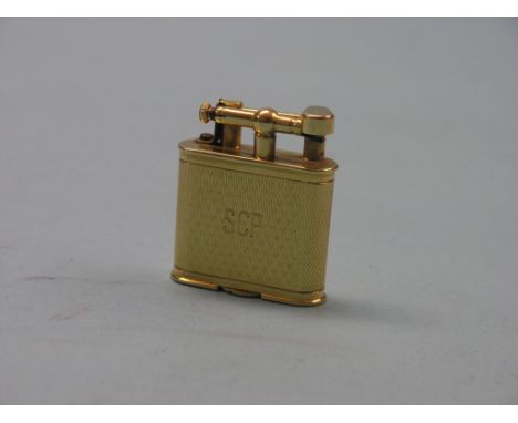 An 18ct. gold Dunhill cigarette lighter, engine-turned, London 1926, 44.6 grams gross total