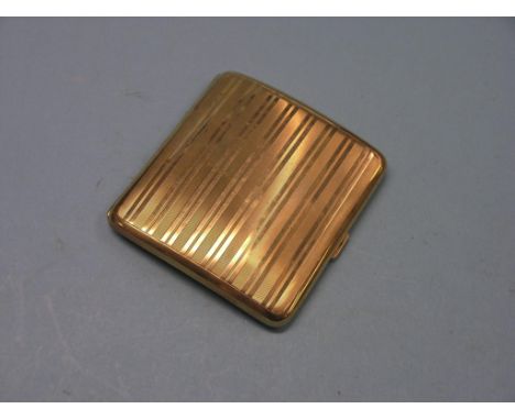 An engine-turned 9ct. gold cigarette case, 95.6 grams