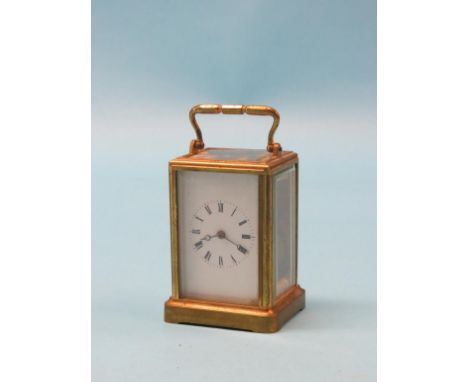 An early 20th century carriage clock, with enamelled dial and timepiece movement, brass case, 5.5in. 