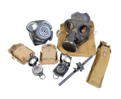 BRITISH MILITARY MKI COMPASS  No B290141, in its original military canvas bag, one other military compass, two military gas m