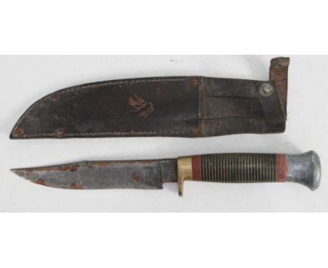 A vintage scout type knife with leather scabbard. 